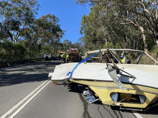 Two people were injured in a head-on collision on Mona Vale Rd, Ingleside, on July 9 after a trailer carrying a boat apparently fish tailed and struck an oncoming car. Picture: Terrey Hills Rural Fire Brigade