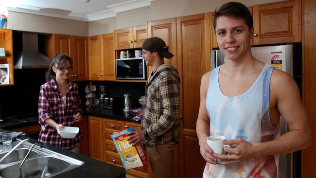 Jacob at home with his mum Noelene and younger brother Caleb.