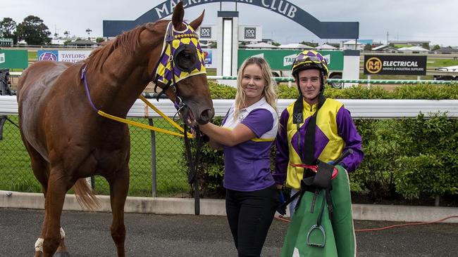 Tyler Leslight (right), with Fire King’s strapper Breanna James, after scoring his first winner at a TAB meeting at Mackay. Picture: Jim Law Race Photography