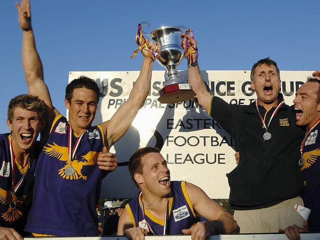Vermont captain Brad Cullen and coach, David Banfield hold up the 2002 premiership cup. Photo: Joanna Fincham