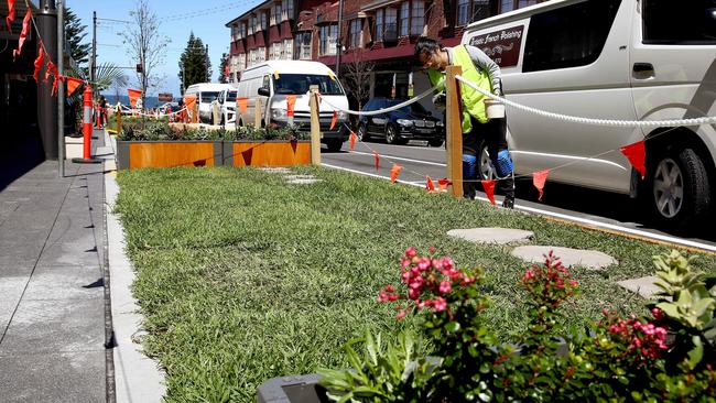 The final touches are added to the outdoor dining areas that will turn a section of Coogee Bay Rd into a one-way street to make way for more outdoor dining for restaurants and cafes. Picture: Toby Zerna