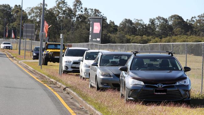 Cars parked on a nature strip outside Helensvale Station in July. Picture: Glenn Hampson.