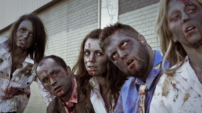 Zombies waiting at a bus stop. Nothing to see here.