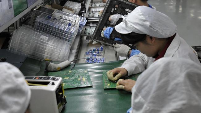 Chinese workers in the Foxconn factory in Shenzhen, in southern China's Guangdong province. Picture: AFP