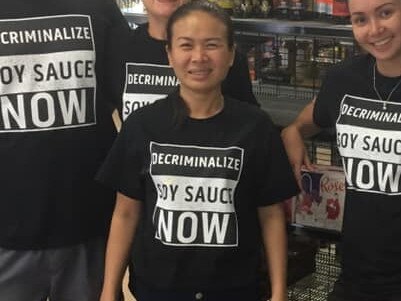 Staff at Moulden Supermarket showed their support for soy sauce with custom-made shirts. Picture: Moulden Supermarket