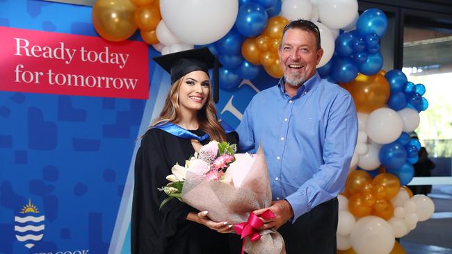 FIFO worker Ric Allen, of Gordonvale, got his booster jab at the Convention Centre before watching his daughter Jessica Allen graduate with a Bachelor of Psychological Sciences from James Cook University. Picture: Brendan Radke