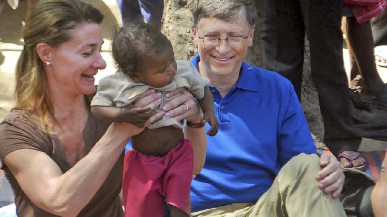 Known for their philanthropy, Bill Gates and his wife Melinda attend to a child as they meet members of the Mushar community at Jamsot Village near Patna, India, in 2011. Picture: Aftab Alam Siddiqui/AP