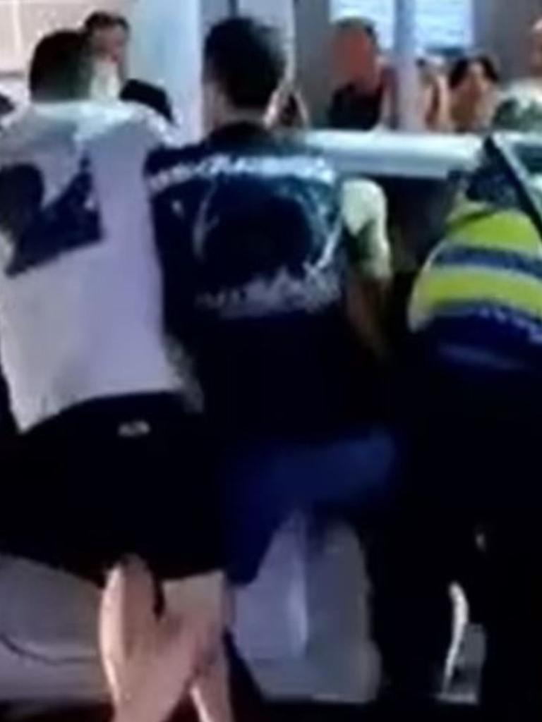 Multiple onlookers jumped in to help police. Picture: 7News