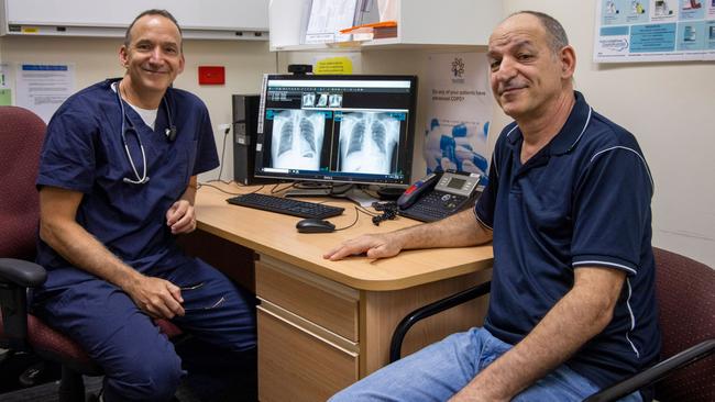 Professor Dan Chambers, from The Prince Charles Hospital, with silicosis sufferer Anthony Constantine with before and after X-rays following a whole lung lavage procedure Mr Constantine had in October. Photo: Supplied