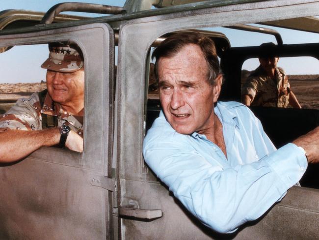 The Big Mo … then-US President George Bush and General Norman Schwarzkopf in a military vehicle in Saudi Arabia during Operation Desert Shield in November, 1990.