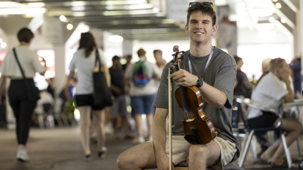 18-year-old violinist Ben Rawlings busking at the Adelaide Showground Farmers' Market in March. Picture: Brett Hartwig