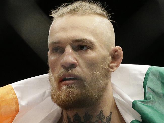 Connor McGregor celebrates after defeating Dustin Poirier in their featherweight mixed martial arts bout at UFC 178 on Saturday, Sept. 27, 2014, in Las Vegas. (AP Photo/John Locher)