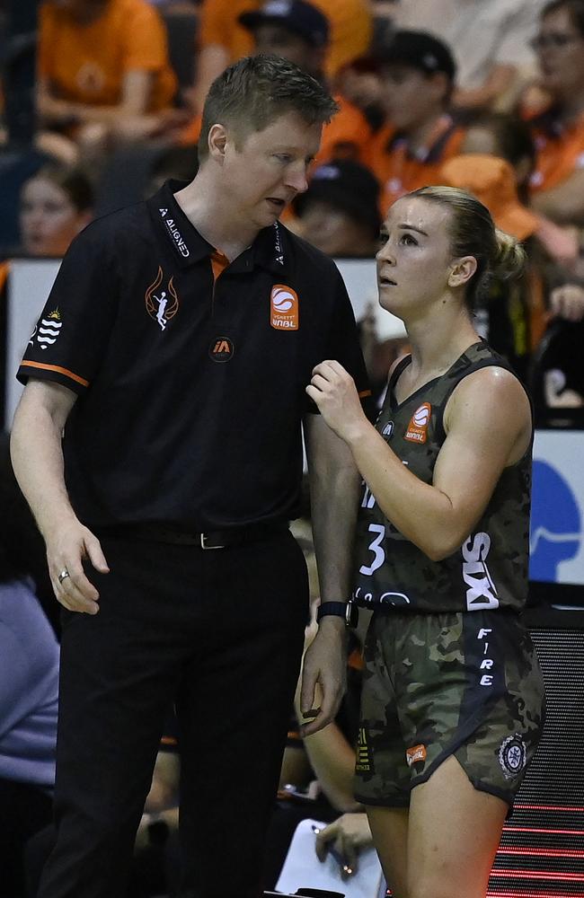 Steph Reid of the Fire and Fire coach Shannon Seebohm speak during the WNBL match between Townsville Fire and Bendigo Spirit at Townsville Entertainment Centre, on February 18, 2024, in Townsville, Australia. (Photo by Ian Hitchcock/Getty Images)