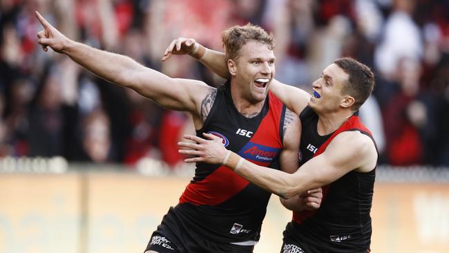 Jake Stringer of the Bombers (left) celebrates a goal during the Round 16 AFL match between the Essendon Bombers and the Sydney Swans at the MCG in Melbourne, Saturday, July 6, 2019. (AAP Image/Daniel Pockett) NO ARCHIVING, EDITORIAL USE ONLY