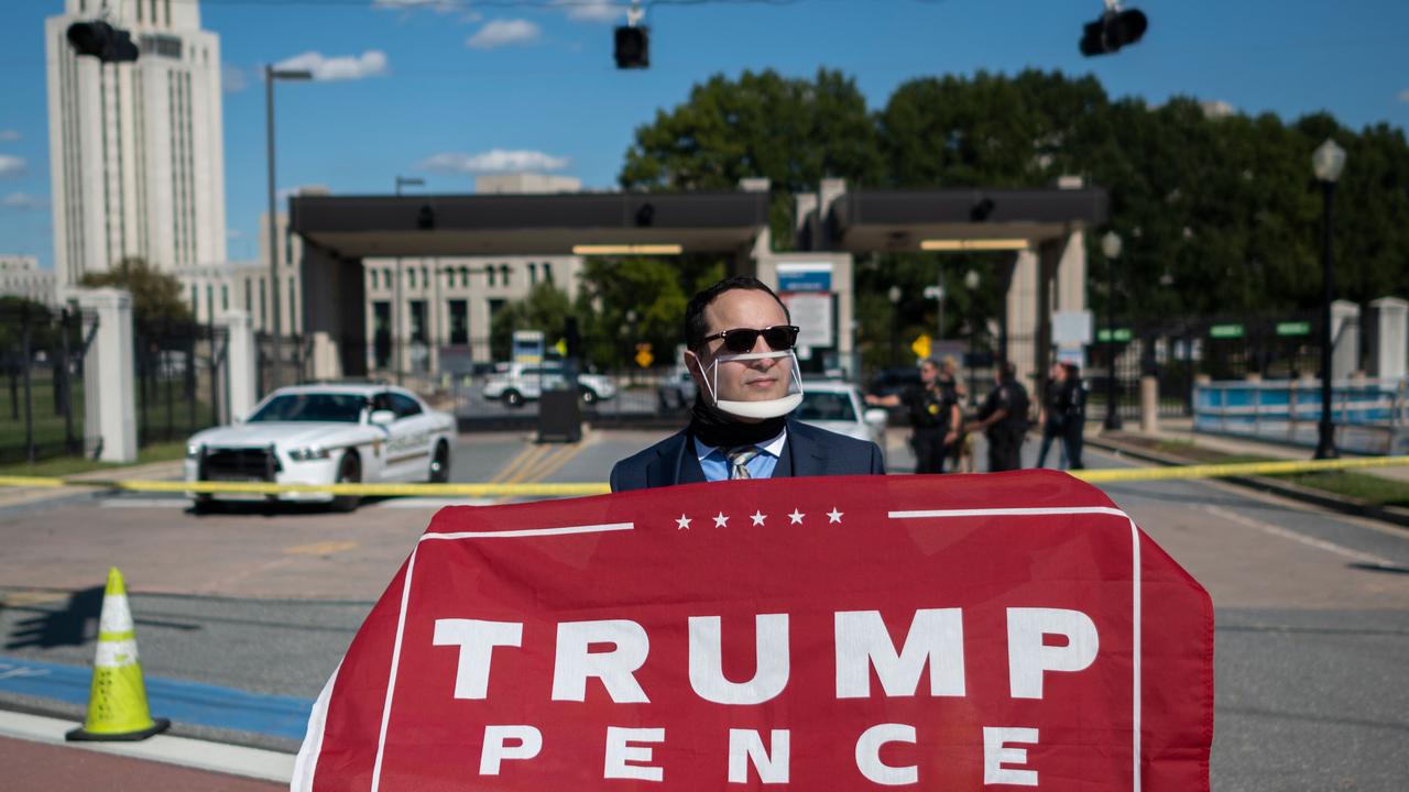 Supporters of US President Donald Trump gather outside of Walter Reed National Military Medical Centre where his is being treated. Picture: Andrew CABALLERO-REYNOLDS.