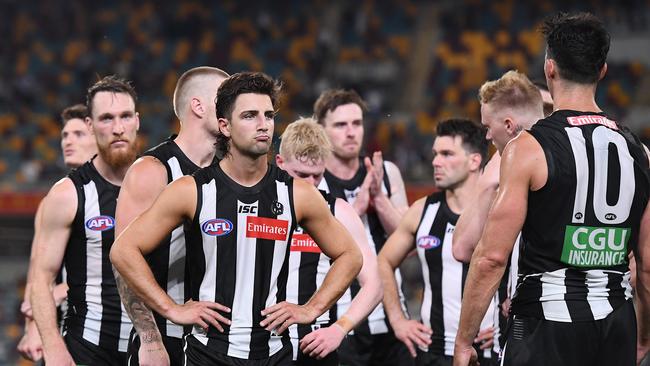 Collingwood players come to terms with their heavy semi-final defeat.