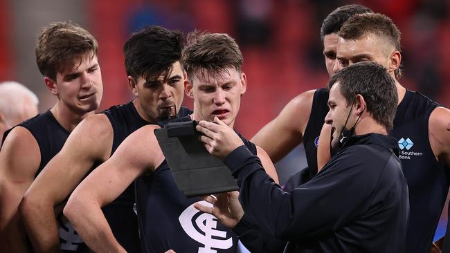 Blues assistant Brent Stanton gets the message across to his midfielders.