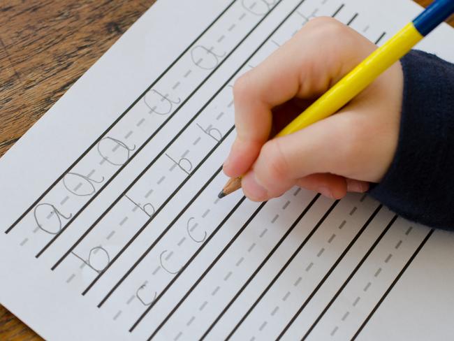 Child practising writing their letters abc Picture: Istock