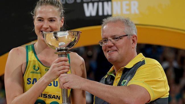 Caitlin Bassett, with Prime Minister Scott Morrison, remains part of the Australian Diamonds squad, and captain, for now. Picture: AAP Image/Richard Wainwright