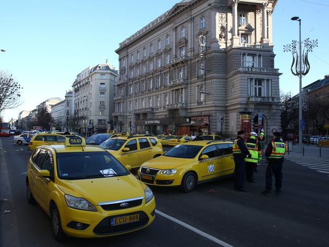 Hungarian police officers ... control the traffic in downtown Budapest. Picture: AFP