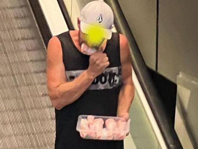 The man was captured taking a bite out of the raw chicken drumstick. Photo: Instagram/sh*tadelaide