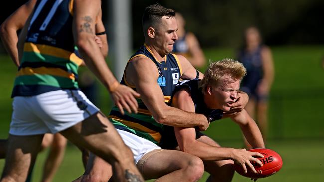 SKOB captain Sam Critchley lays a tackle against Old Melburnians. Picture: Andy Brownbill