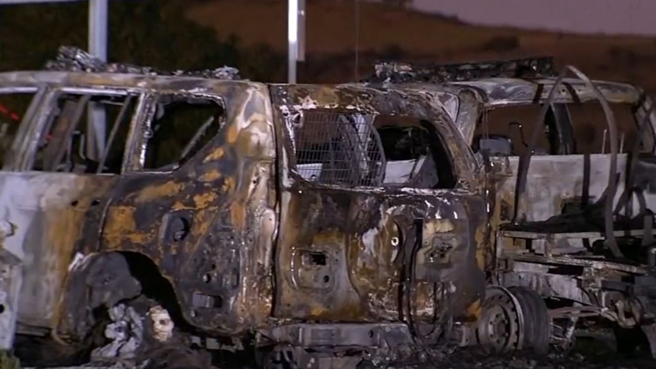 Three police cars were destroyed in the suspected arson attack. Picture: 9 News