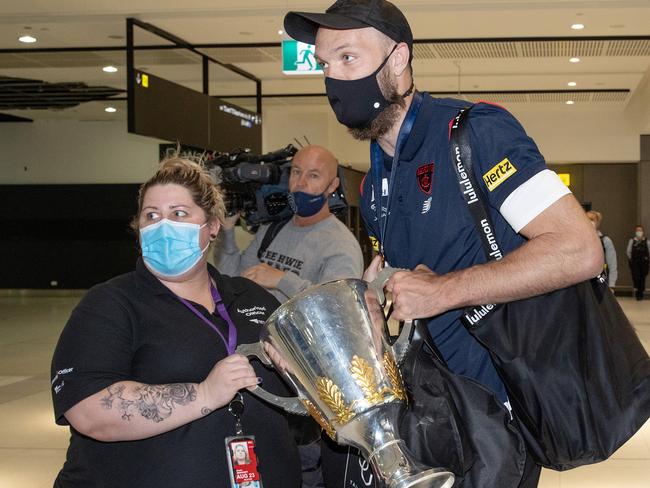 Max Gawn poses with a fan and the cup at the airport. Picture: Mark Stewart