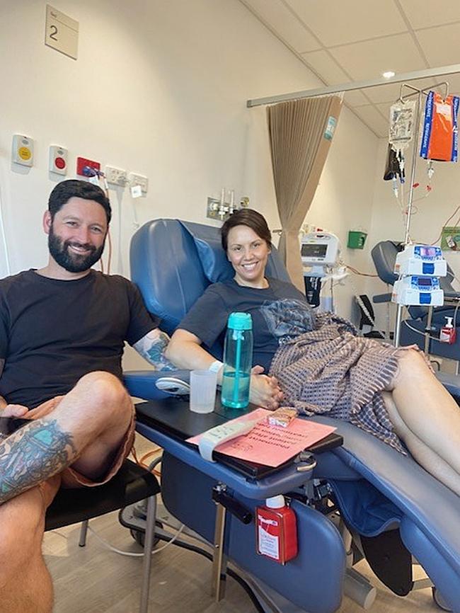 Renae Ellaway with husband James on her first day of treatment for an early stage of breast cancer, October 2023. Photo: Supplied.