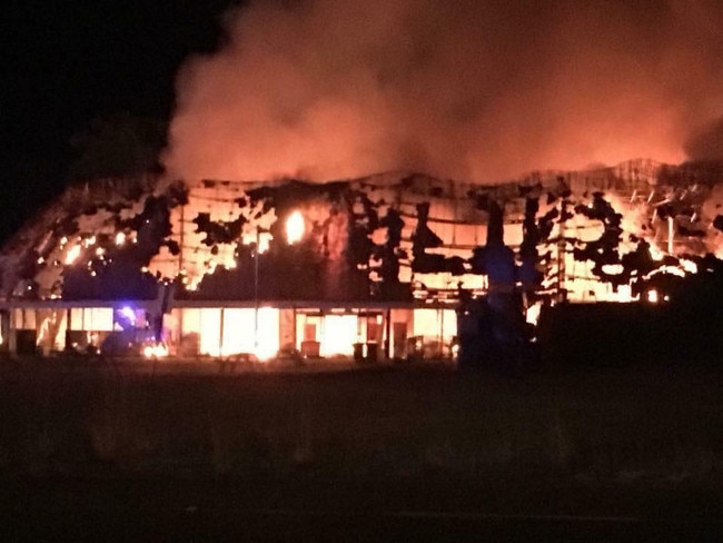 Fire investigators are expected on the NSW mid-coast to pick through the rubble of the iconic Ayres Rock Roadhouse which was destroyed in a fire.