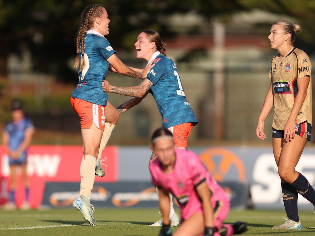 Laini Freier celebrates a goal with twin sister Sharn Freier of the Roar, Australia. Picture: Scott Gardiner/Getty Images