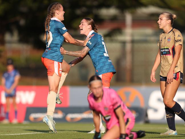 Laini Freier celebrates a goal with twin sister Sharn Freier of the Roar, Australia. Picture: Scott Gardiner/Getty Images