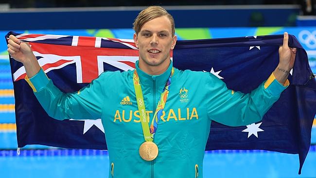 Kyle Chalmers shows off his gold medal after winning the 100m freestyle. Picture: Alex Coppel