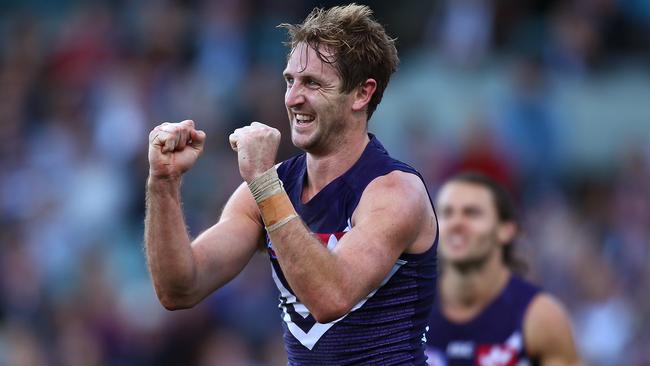 PERTH, AUSTRALIA — JUNE 18: Michael Barlow of the Dockers celebrates a goal during the round 13 AFL match between the Fremantle Dockers and the Port Adelaide Power at Domain Stadium on June 18, 2016 in Perth, Australia. (Photo by Paul Kane/Getty Images)