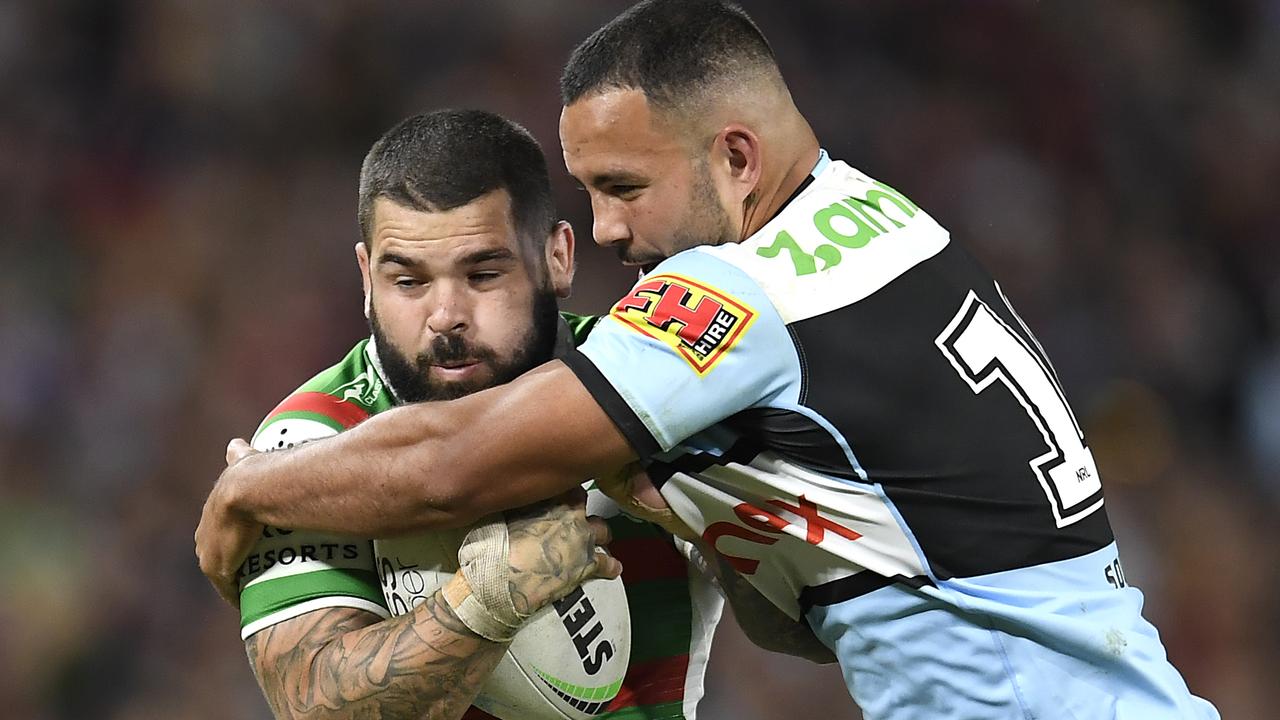 Adam Reynolds of the Rabbitohs is tackled during the round 10 NRL match between the Cronulla Sharks and the South Sydney Rabbitohs at Suncorp Stadium, on May 15, 2021, in Brisbane, Australia. (Photo by Albert Perez/Getty Images)