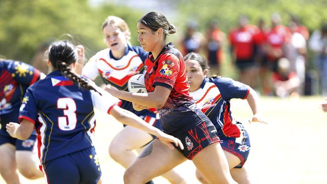 Action from 16 Girls Tonga v Philippines. Harmony Nines Rugby League. Picture: John Appleyard