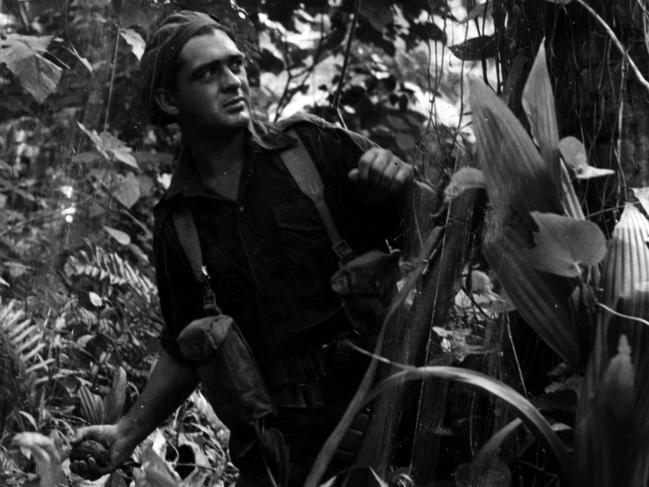 June 1944: Private HT Booby ready to throw No 36 Mk 1 hand grenade against Japanese position on Karkar Island, New Guinea. Picture: File photo