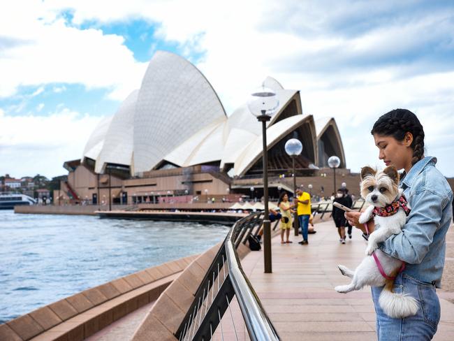 SYDNEY, AUSTRALIA - NewsWire Photos , October 24, 2021: Pedestrians are seen walking at the Opera House forecourt.   Picture: NCA NewsWire / Flavio Brancaleone