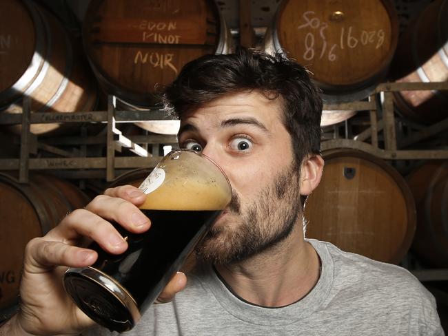 Nick Malin knocks back a Stave Breaker Russian Imperial Stout at Stomping Ground Brewery Collingwood. Picture: David Caird