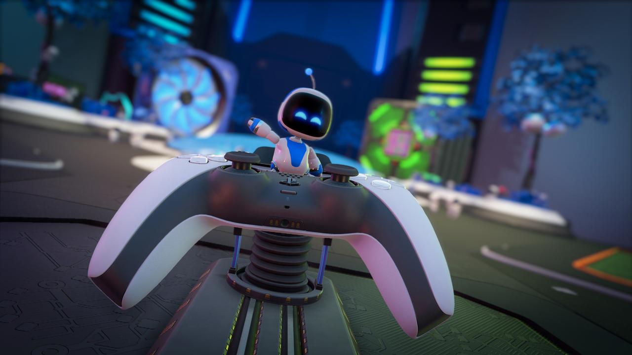 A scene from Astro's Playroom. Here Astro is sitting on top of a PS5 controller.