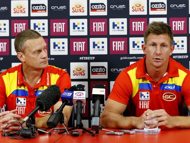 Nathan Bock announces his retirement from the Gold Coast Suns and AFL, alongside coach Guy McKenna in 2014. Picture: JERAD WILLIAMS