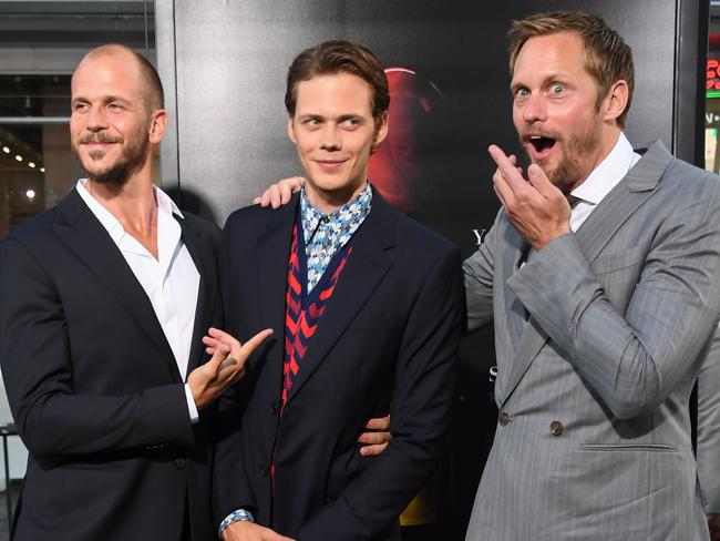 Bill Skarsgard (centre) with actor brothers Gustaf (left) and Alexander, arrive for yesterday’s world premiere of It in Hollywood. Picture: AFP PHOTO / Robyn Beck