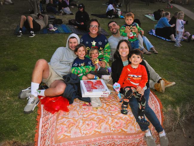 Gavin, Arabella, Gigi, Annalisa, Samantha, Loris, Leo and Luciano getting festive at the Phillip Island Christmas Carols by the Bay at the Cowes Foreshore on Tuesday, December 10, 2024. Picture: Jack Colantuono