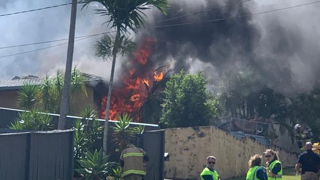 Flames coming out of the Mudgeeraba house. Picture: Adam Guiver