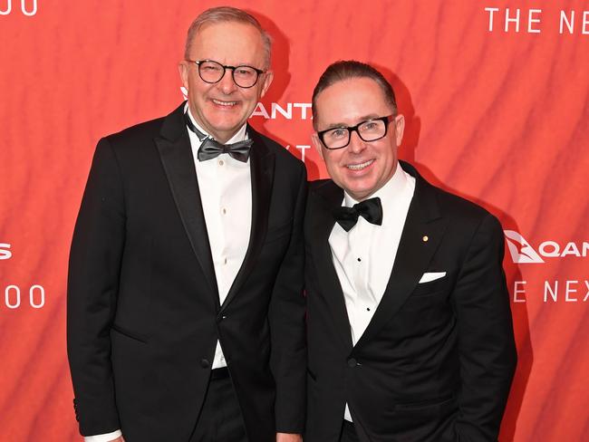 SYDNEY, AUSTRALIA - MARCH 31: Australian Prime Minister Anthony Albanese (L) stands with Qantas CEO Alan Joyce as they attend the Qantas 100th Gala Dinner at Jetbase 96 hangar at Sydney's International Airport on March 31, 2023 in Sydney, Australia. (Photo by James D. Morgan/Getty Images)