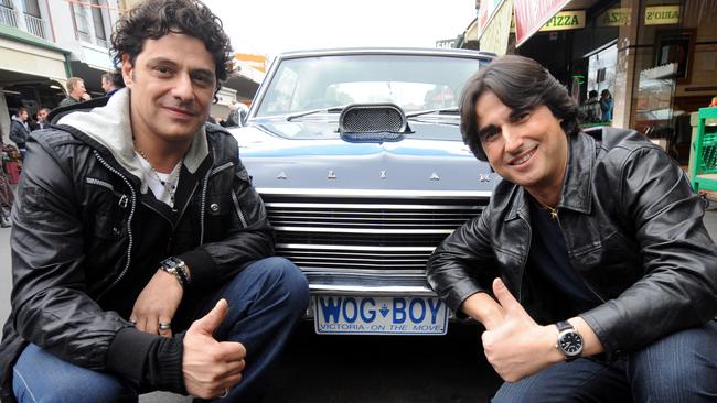 Vince Colosimo and Nick Giannopoulos (right) and pose in front of the "Wog Boy" Valiant in Yarraville near in 2009. Picture: AAP Image/Julian Smith