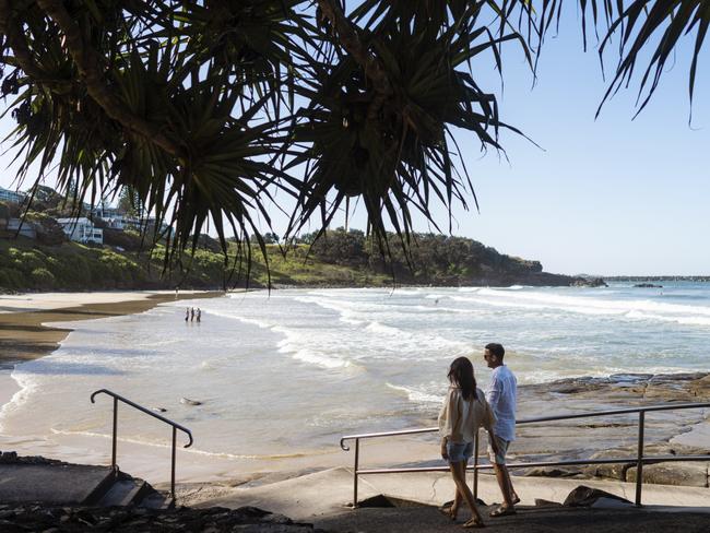 ESCAPE. 06 FEB, 2022. Couple enjoying a day out at Yamba Main Beach, Yamba. Picture: Destination NSW