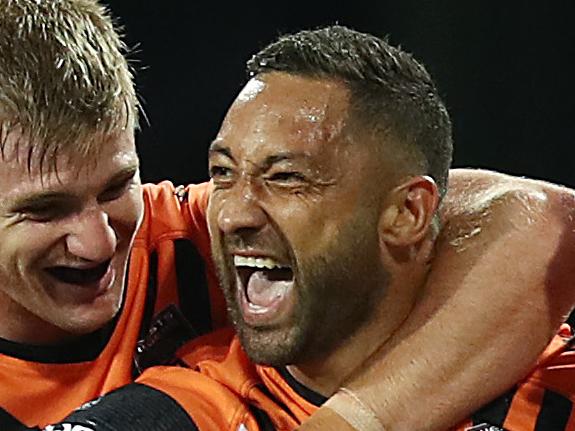 SYDNEY, AUSTRALIA - SEPTEMBER 01: Benji Marshall of the Tigers celebrates scoring a try with team mates during the round 24 NRL match between the St George Illawarra Dragons and the Wests Tigers at Sydney Cricket Ground on September 01, 2019 in Sydney, Australia. (Photo by Mark Metcalfe/Getty Images)