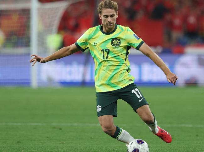 HANGZHOU, CHINA - MARCH 25: Ryan Teague of Australia competes the ball during the FIFA World Cup Asian Qualifiers Group C match between China and Australia at Hangzhou Olympic Sports Centre Stadium on March 25, 2025 in Hangzhou, China.  (Photo by Lintao Zhang/Getty Images)