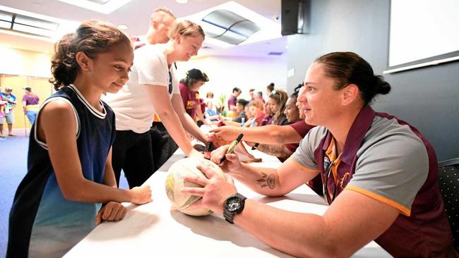 Shyloh Tofae (left) receives an autograph from Steph Hancock of the Broncos at the Broncos Leagues Club in Brisbane, Monday, October 1, 2018. The Brisbane Broncos won the inaugural Women's NRL Premiership after defeating the Sydney Roosters 34-12 in Sundays Grand Final match in Sydney. (AAP Image/Dave Hunt) NO ARCHIVING. Picture: DAVE HUNT